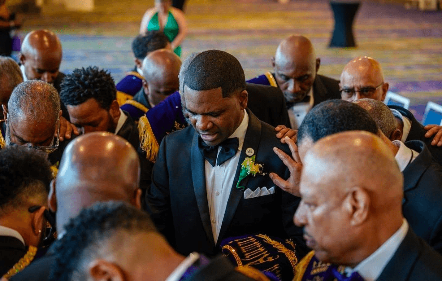 Purple Knights gathered during the Mardi Gras Ball